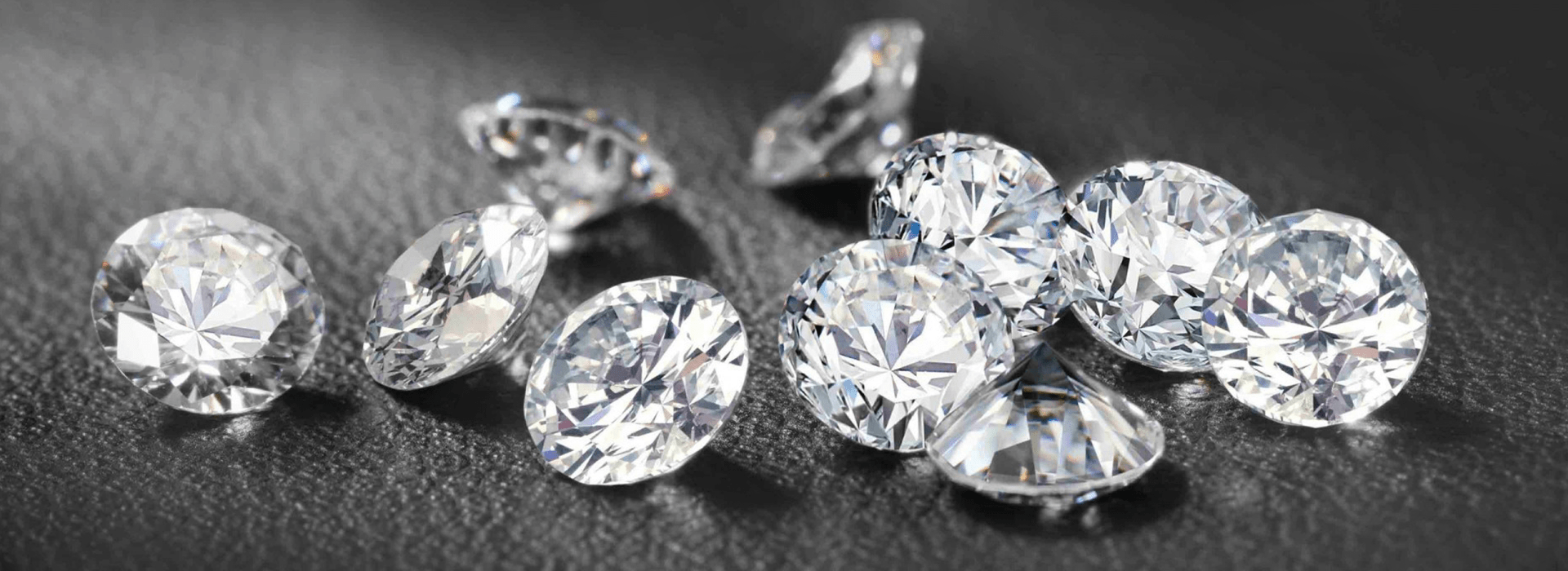 A collection of high-quality, brilliant-cut loose diamonds representing the wholesale trade sector.